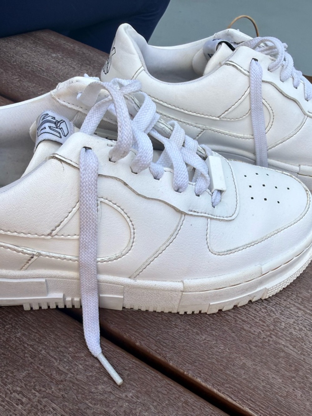 Nike Air Force 1 Pixel Triple White colorway.